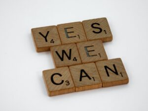 Wooden tiles from the game Scrabble spell out Yes We Can